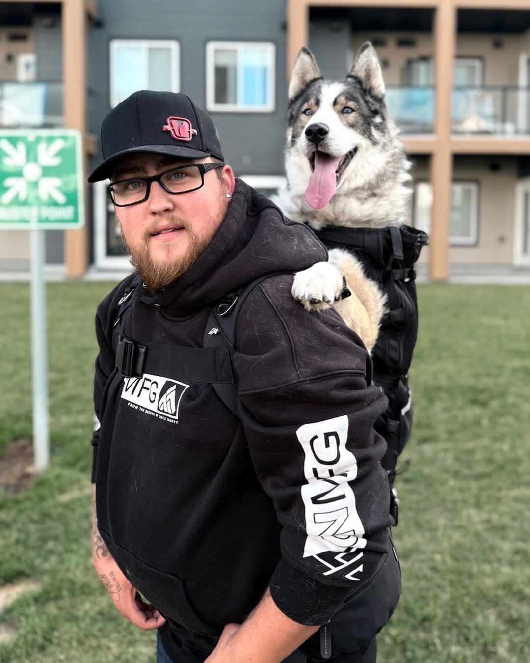 PACKMATE® motorcycle dog carrier lifestyle rider with husky front view